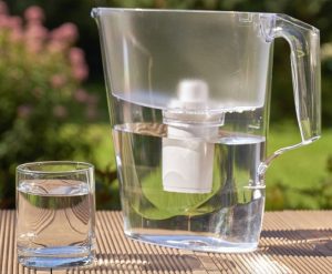 Water filer in a pitcher of clean water
