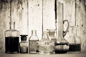 Chemistry bottles and jars containing substances.