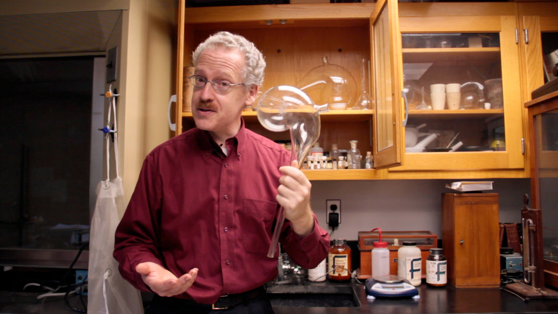 Scientist with chemistry glassware