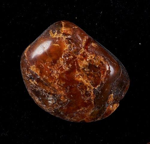 Canadian amber, a red rock with golden swirl patterns