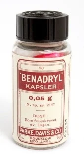 An old glass bottle for Benadryl