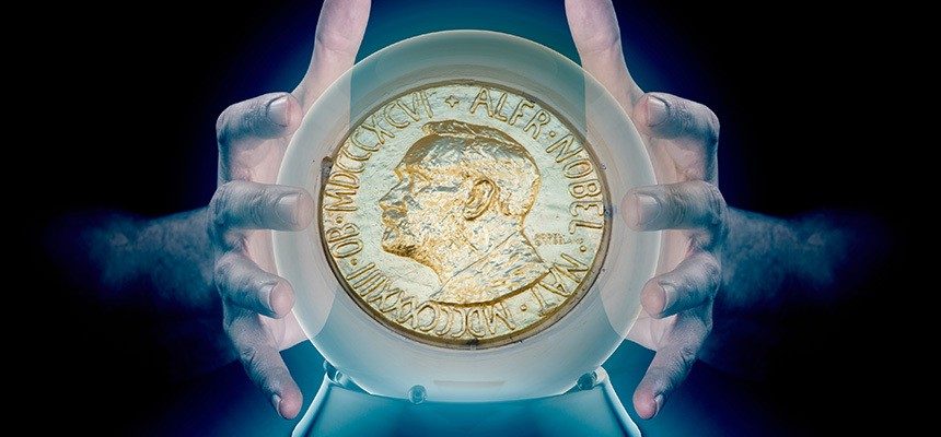 Hands over a crystal ball with the chem nobel prize gold coin inside