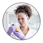 A chemist holding a beaker