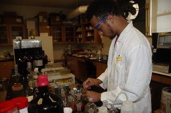 Student working in a lab at Xavier University