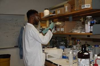 Student working in a lab at Xavier University