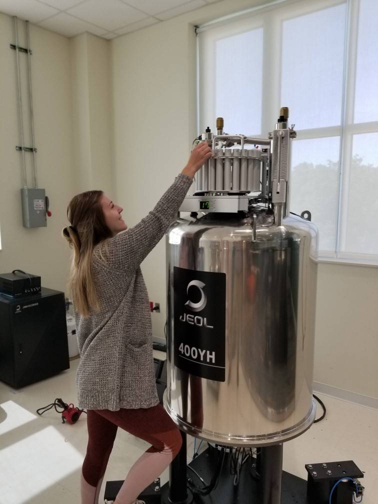 Student from High Point University using the H1NMR Spectrometer. 