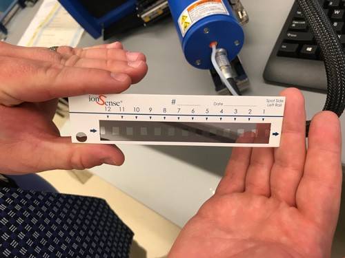 hands holding test forensic strip