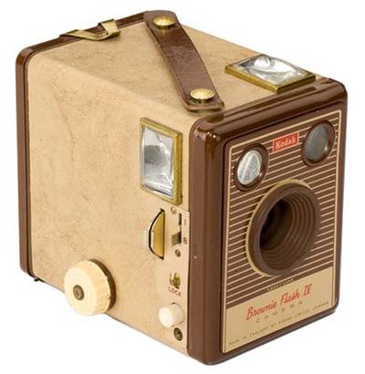 A Kodak brownie camera, a box-shaped brown device