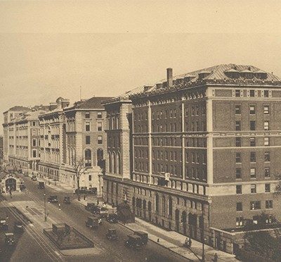 Sepia-toned photo of several buildings along a street