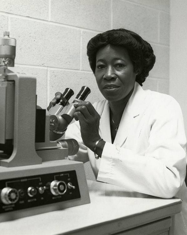 Black and white photograph of Greene working in the lab