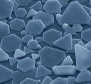 Microscopic silver halide crystals form hexagonal and triangular shapes