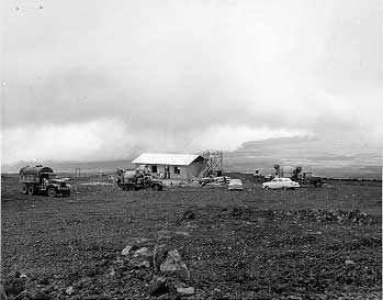 Mauna Loa Observatory, a small building in an empty field, under construction