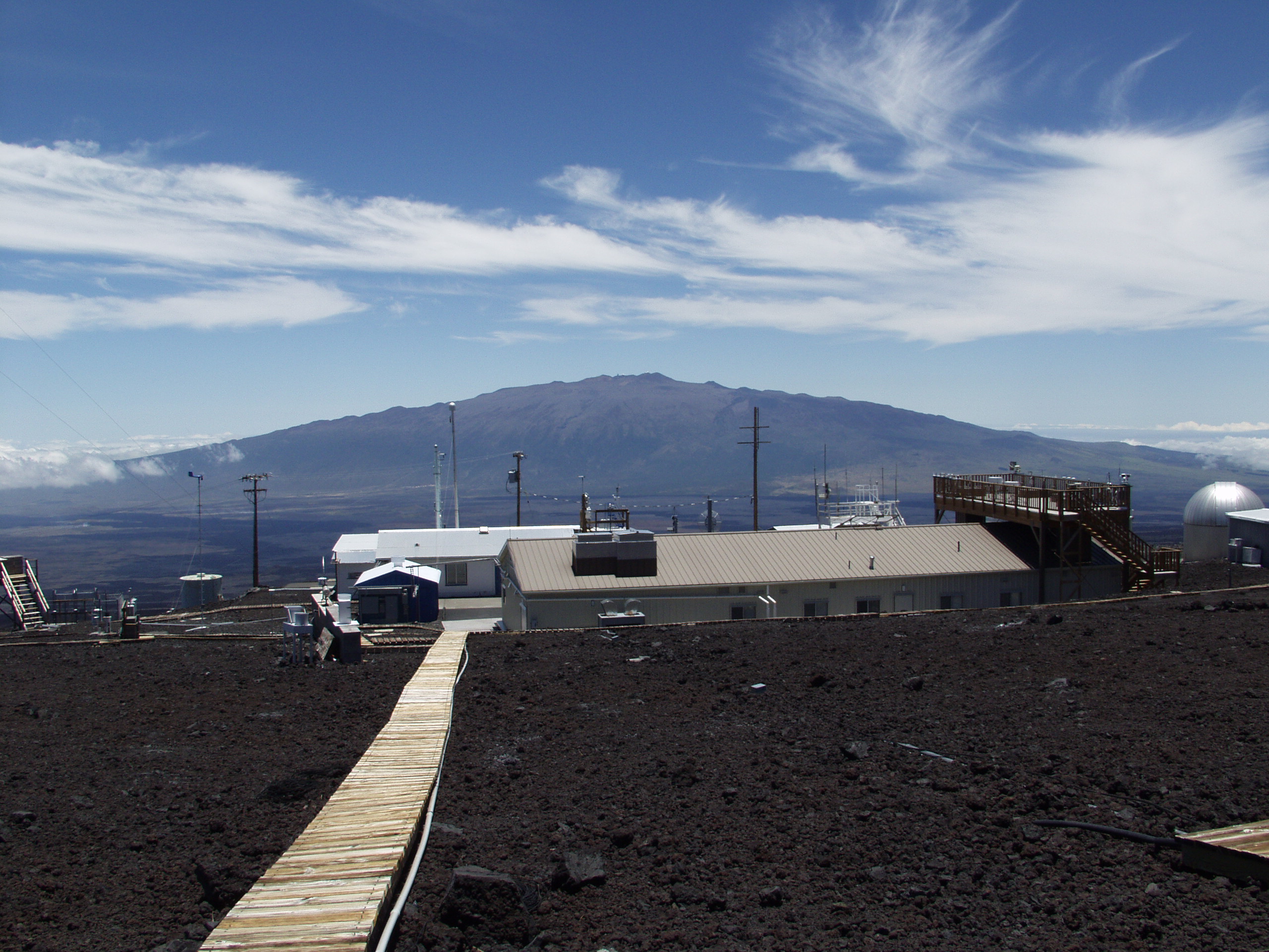 The Mauna Loa Observatory, a building in front of a mountain