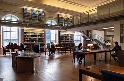 Museum library space, including tables and bookshelves
