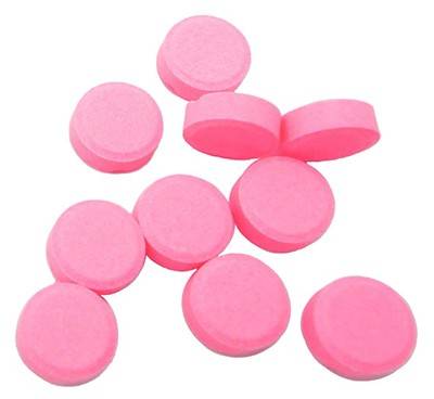 Round, pink Warfarin pill tablets
