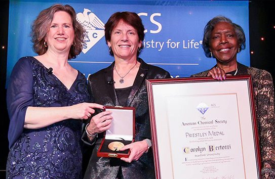 Carolyn Bertozzi Receiving the 2024 Priestley Medal From ACS President Mary K. Carroll and ACS President-Elect Dorothy J. Philips
