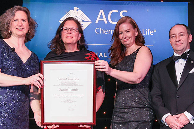 Photo of 2019 award recipient Diane Bunce being presented her award