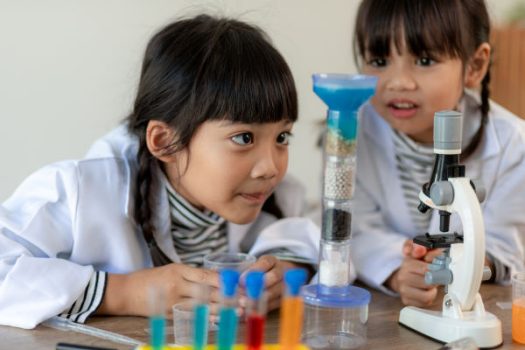 Two small girls doing a science experiment 