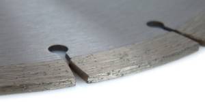 Close-up view of diamond chips on the edge of a saw blade