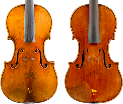 Two antique violins without strings on a white background with small yellow squares at the bottom, indicating where the researchers sampled. 