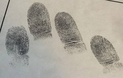 Samples of fingerprints isolated on white paper