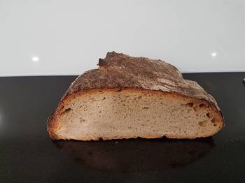 A loaf of sourdough bread sliced in half.