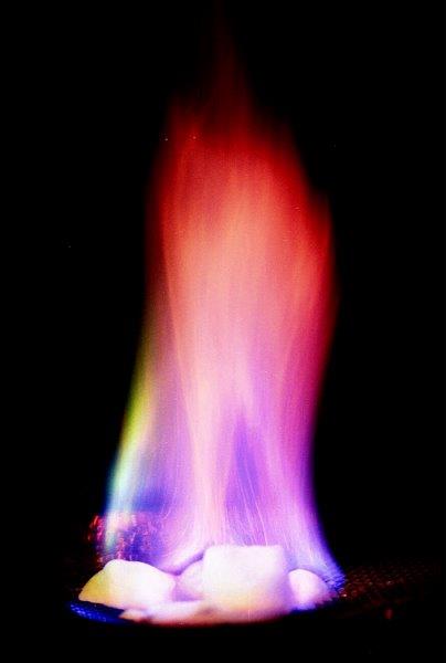 Ice burning with a large rainbow-colored flame