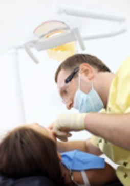 Dentist working on patient's teeth.
