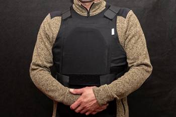 Torso of man wearing protective vest